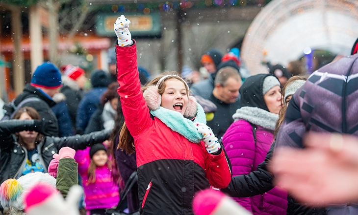Girl celebrating the New Year in a crowd of people