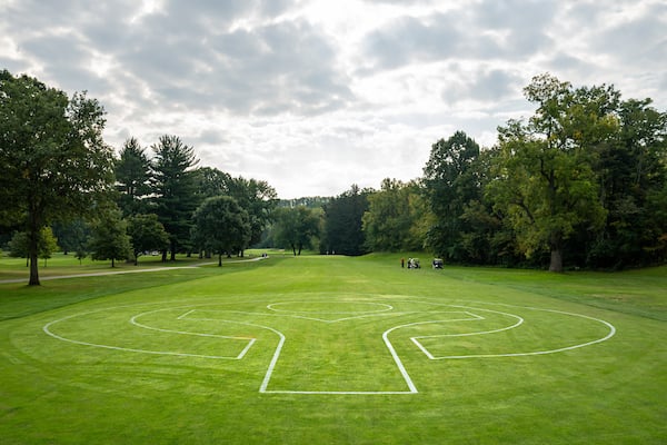 Image of Big Met golf course with giant leafman outline on the fairway