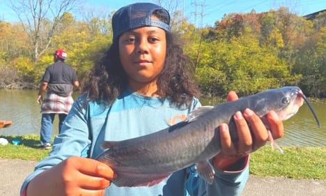 Child holding fish