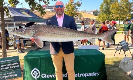 Man holding a Lake Sturgeon Cut-out