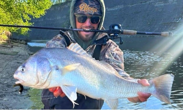 Man holding large fish in Rocky River