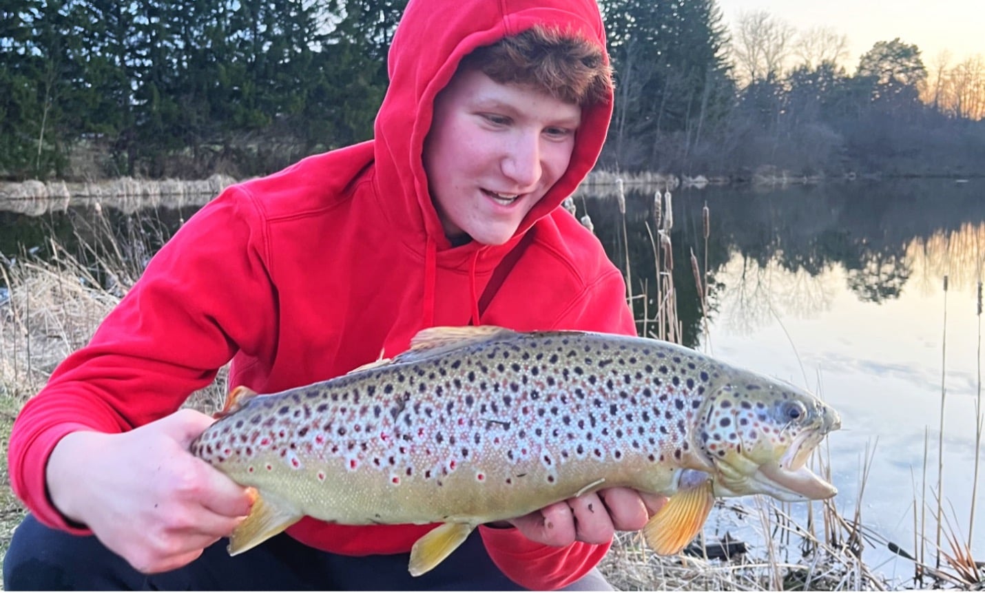Teen holding fish at Ledge Lake