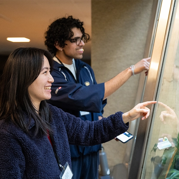 Photo of students observing animals at the Primate, Cat and Aquatics building