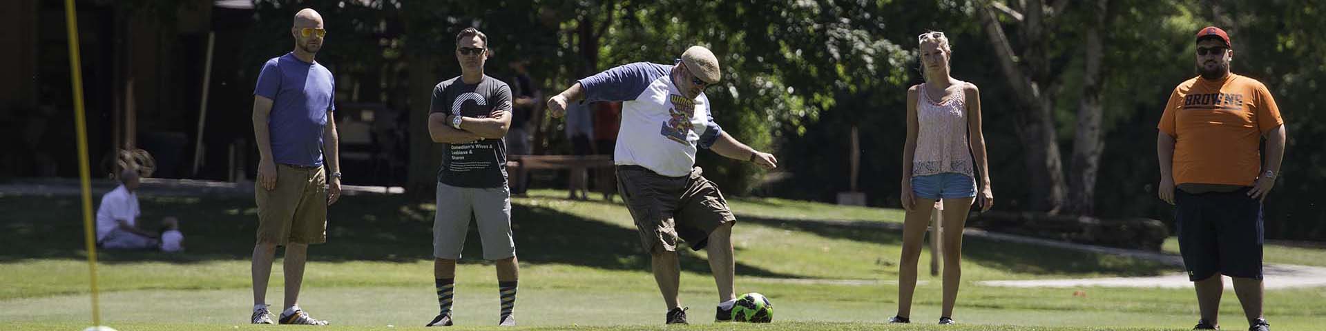 People playing footgolf