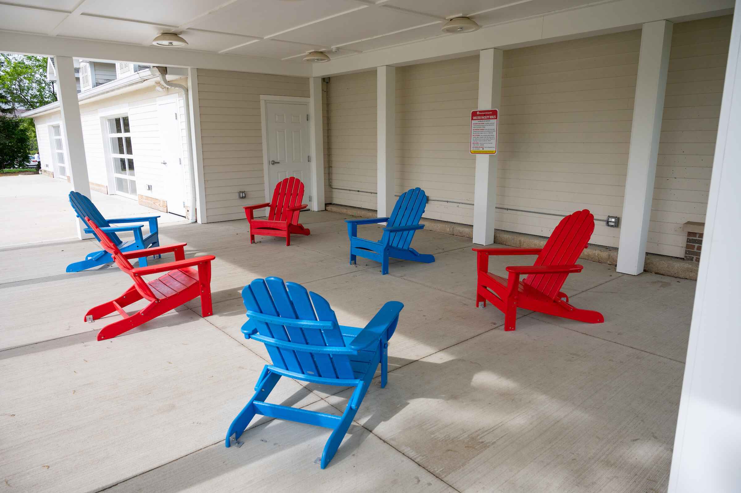 Patio with blue and red patio chairs