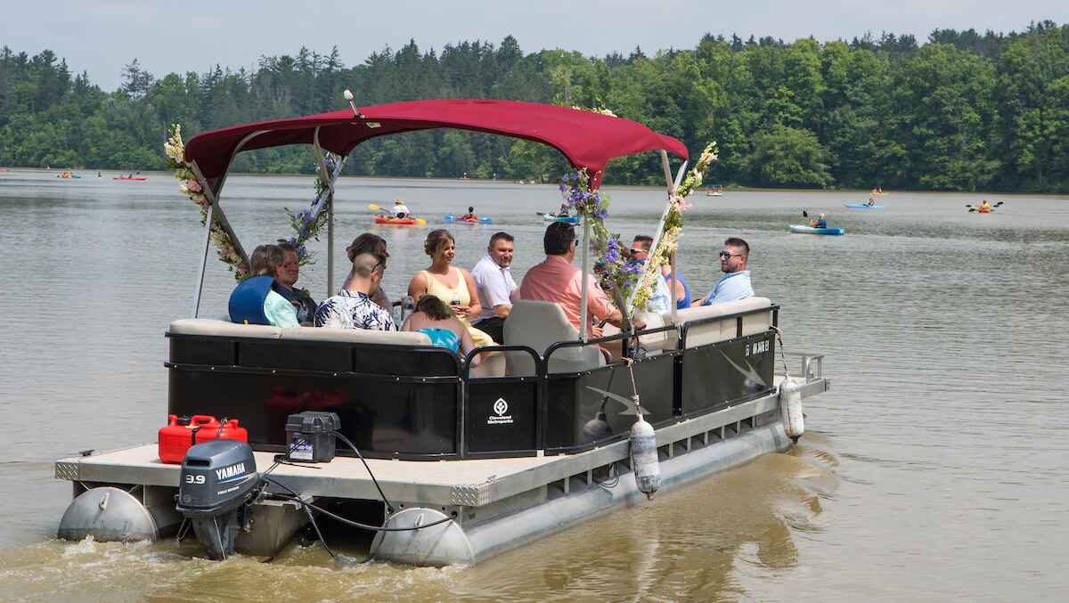 Group of people on a pontoon boat on a lake