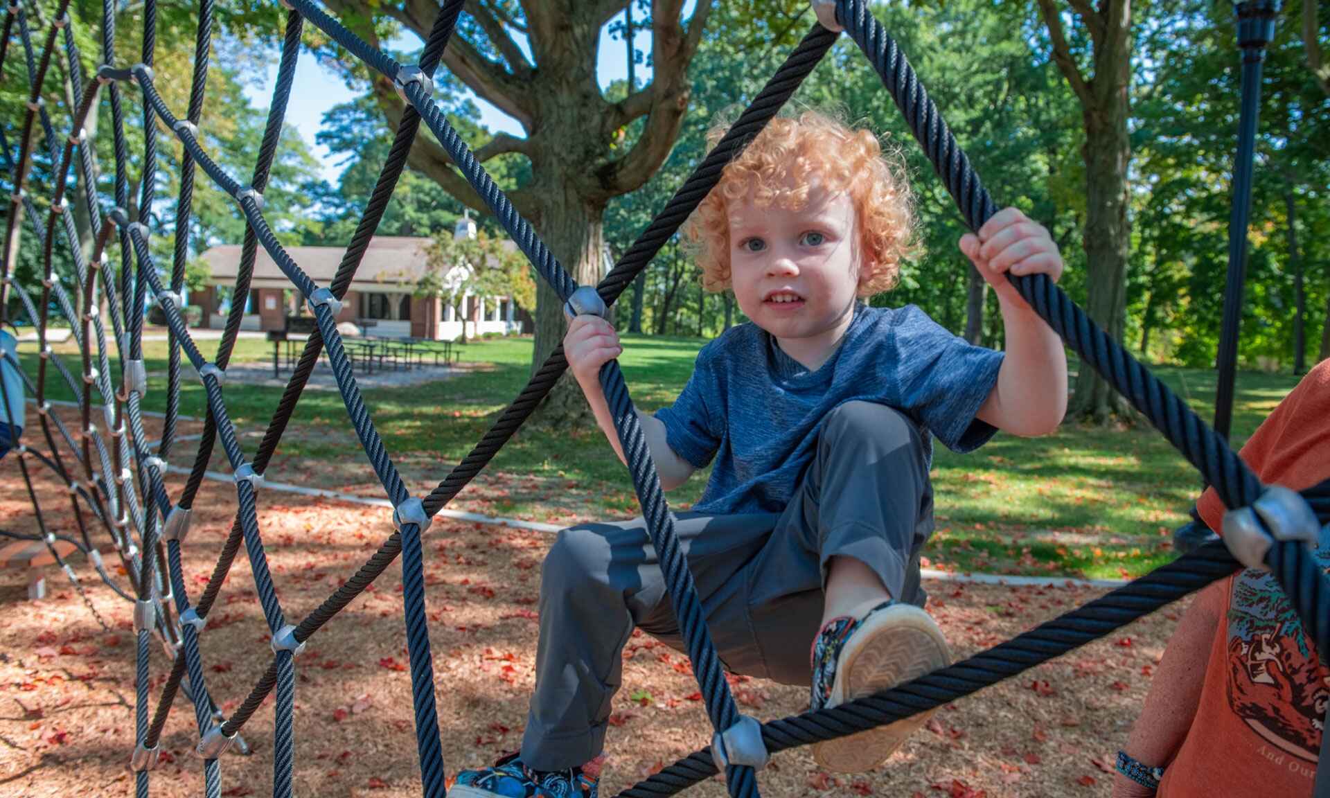 Child playing on a jungle gym