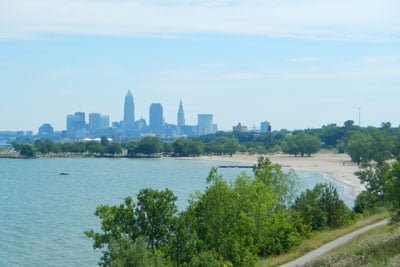 A beach with the city scape in the background
