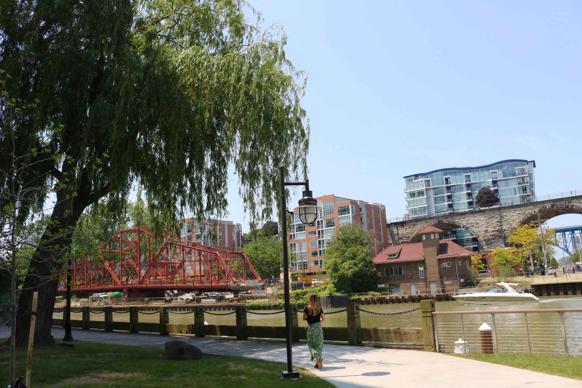 Walking path along a river and building skyline