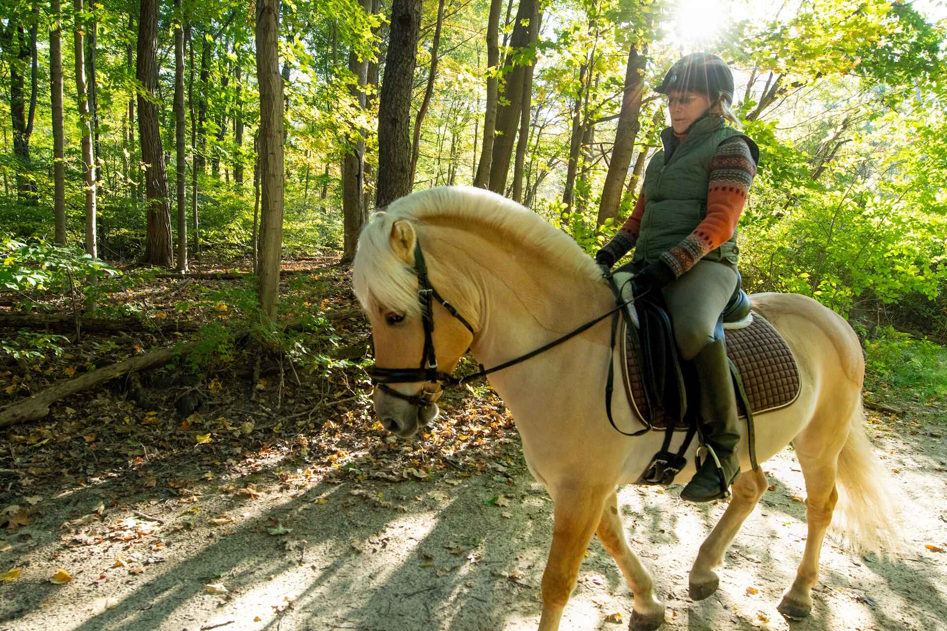 A woman riding a horse