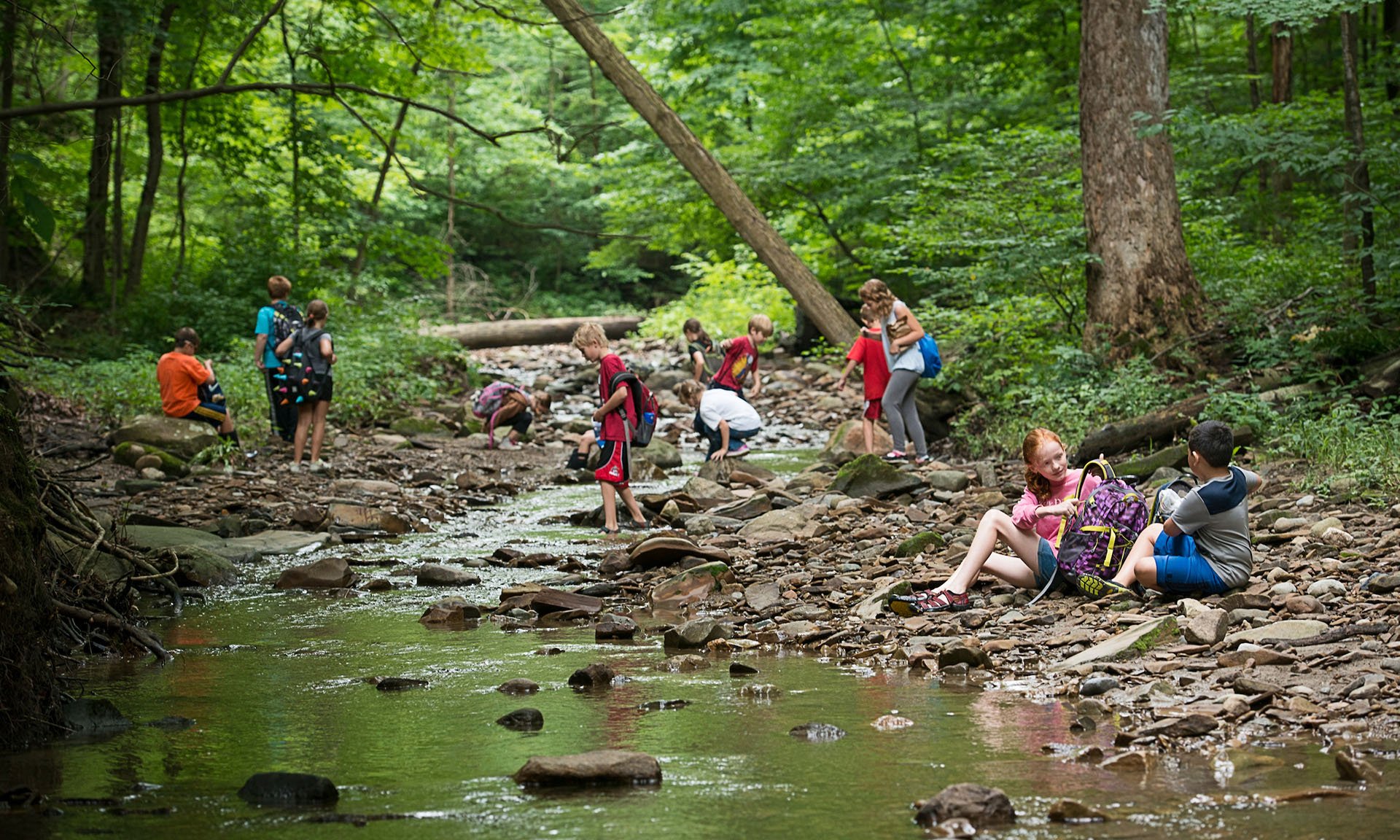 Kids exploring in South Chagrin by water