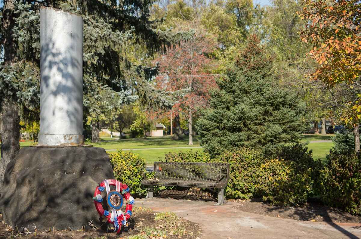 A bench in front of a field