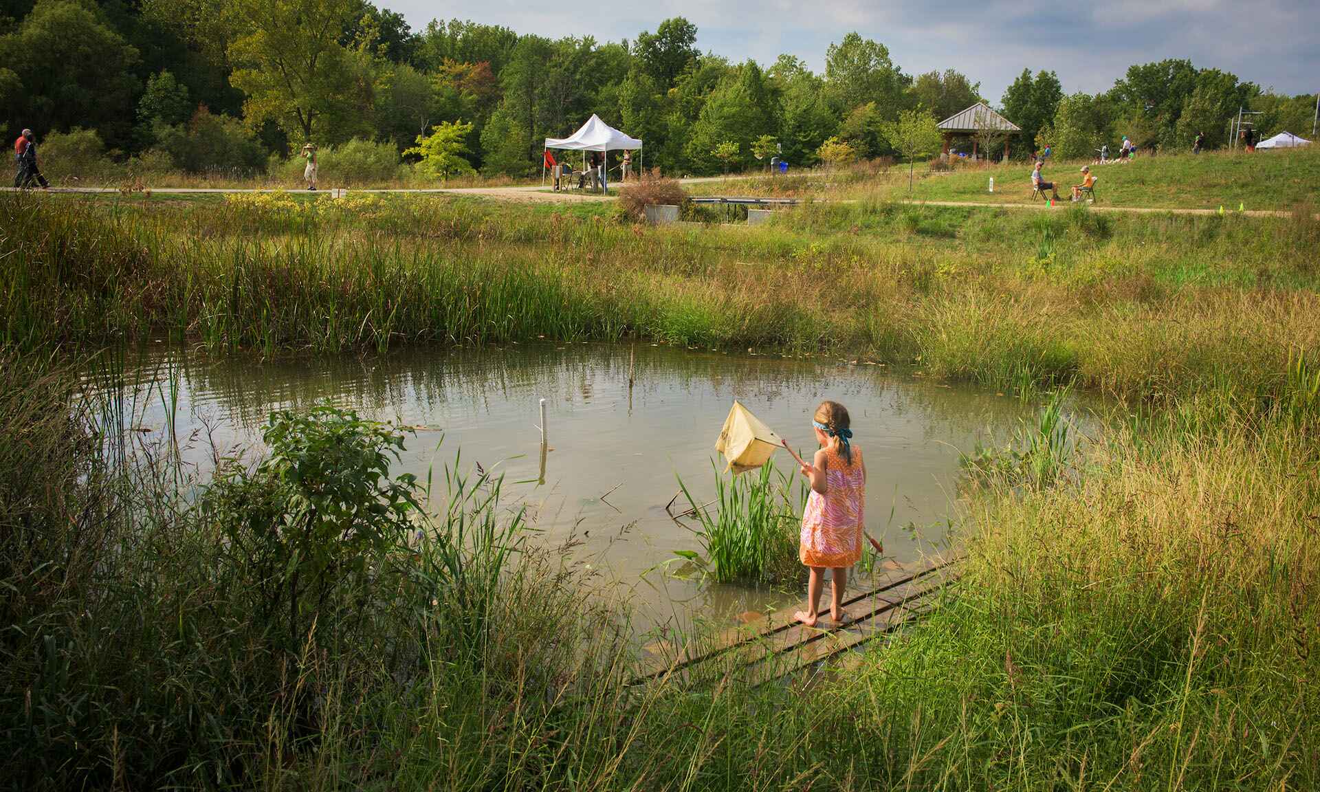 Girl by pond