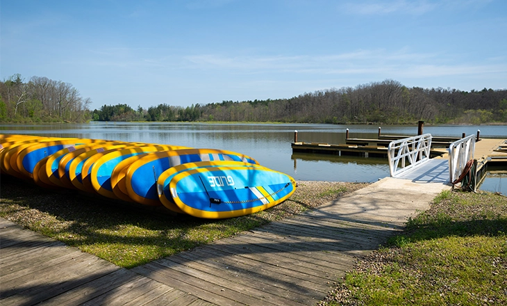photo of standup paddleboards and boat dock at Hinckley Lake