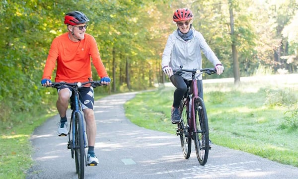Two-Cyclists-on-a-Bike-Path.jpg