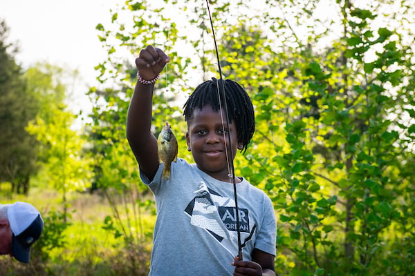 CHILD WITH FISH CHILD WITH FISH