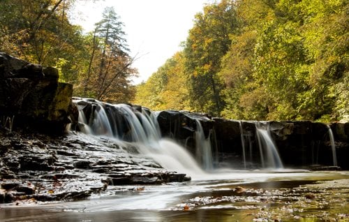there is a waterfall that is flowing down the side of a hill, an impressionist painting by Bradley Walker Tomlin, featured on flickr, hudson river school, cascading waterfalls, william penn state forest, cahaba river alabama